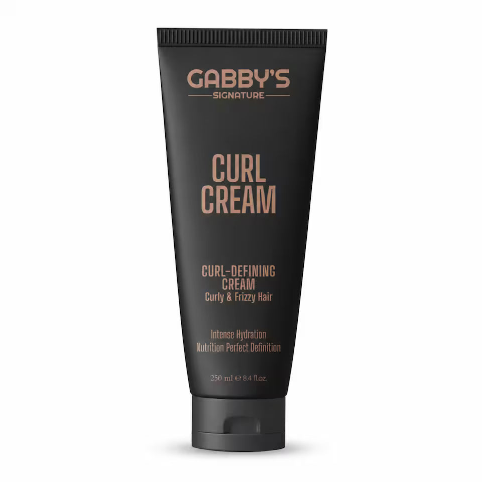 A black squeeze tube of Gabby's Signature Curl Cream with rose gold text, shown on a clean white background.