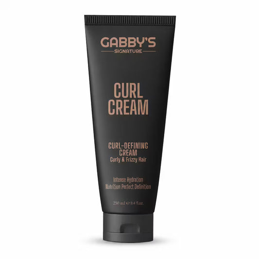 A black squeeze tube of Gabby's Signature Curl Cream with rose gold text, shown on a clean white background.