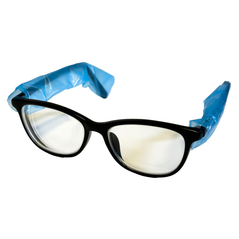 Black cat-eye style eyeglasses with clear lenses and blue protective plastic wrap on the temples, shown on a white background.