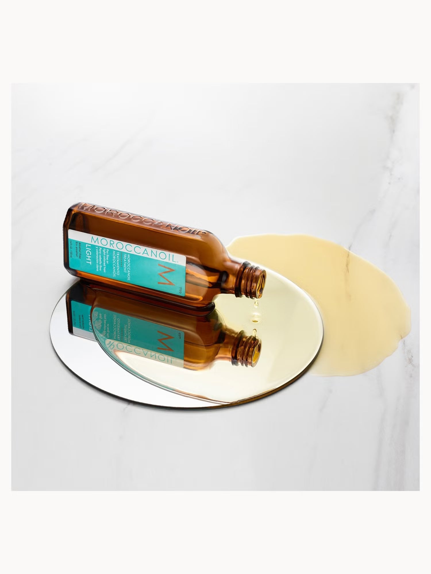Brown bottle with a green label on a reflective surface