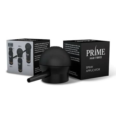 Black spray applicator for Prime Hair Fibres shown in front of its retail packaging boxes on a white background.