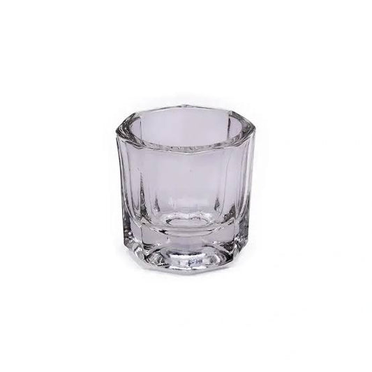 A small clear glass shot glass with a faceted, octagonal design, shown on a plain white background.