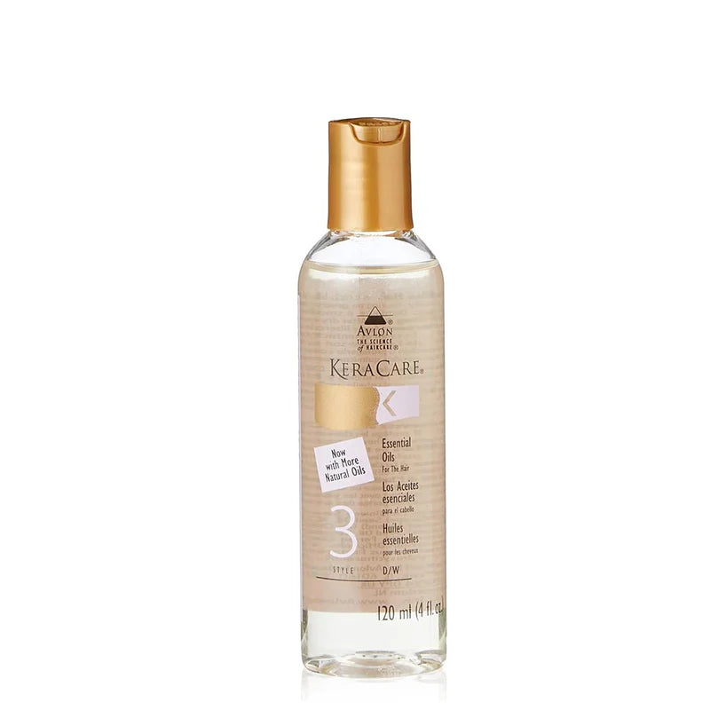 A bottle of Avlon Avirelle KeraCare K-3 Soft Touch Keratin Oil on a white background. The bottle is clear glass showing the beige-colored oil inside, with a metallic gold cap and a beige label featuring gold and white text.