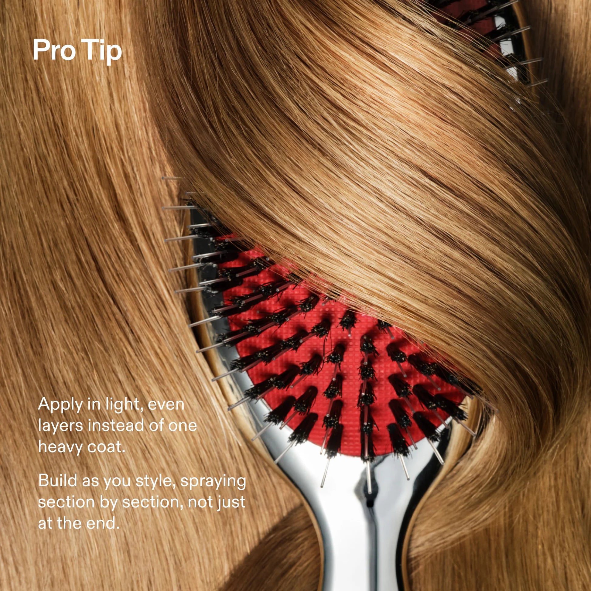 Close-up of a hairbrush with a red and black bristle pad and silver metal frame, shown through layered light brown to blonde hair. Text on the left reads 'Pro Tip' and gives application instructions.