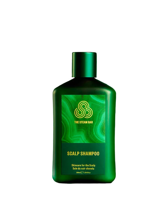 Green bottle of scalp shampoo with a green background