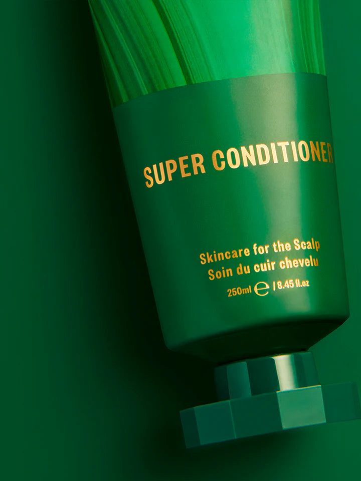 Green bottle of 'Super Conditioner' with gold text on a green background